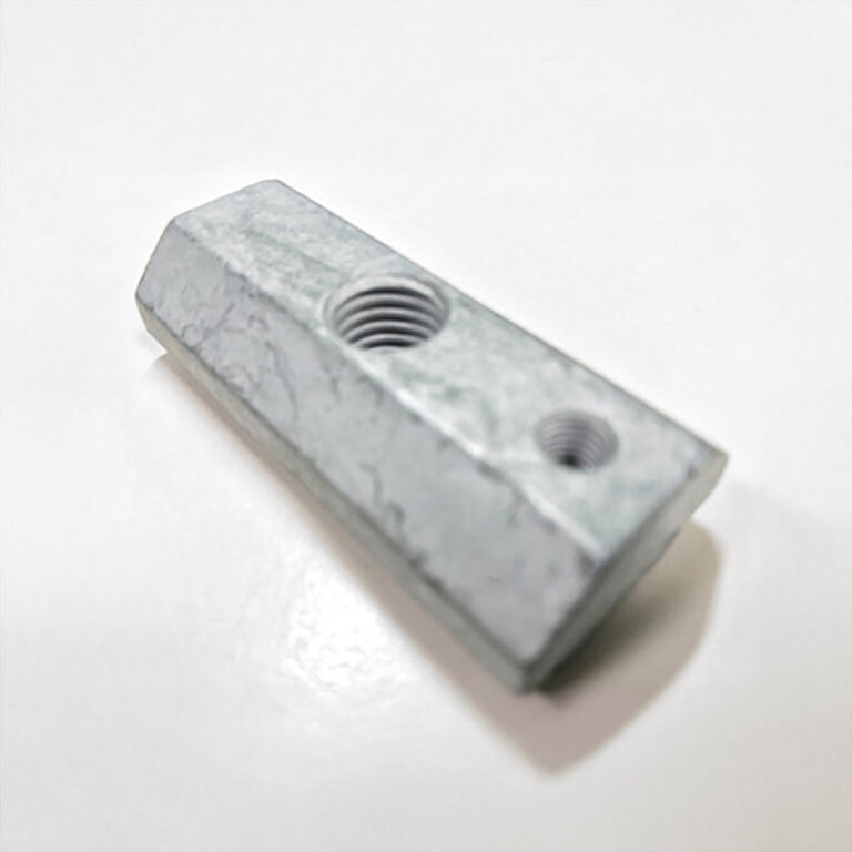 Sonderteil mit zwei Bohrungen und abgeschrägten Seiten